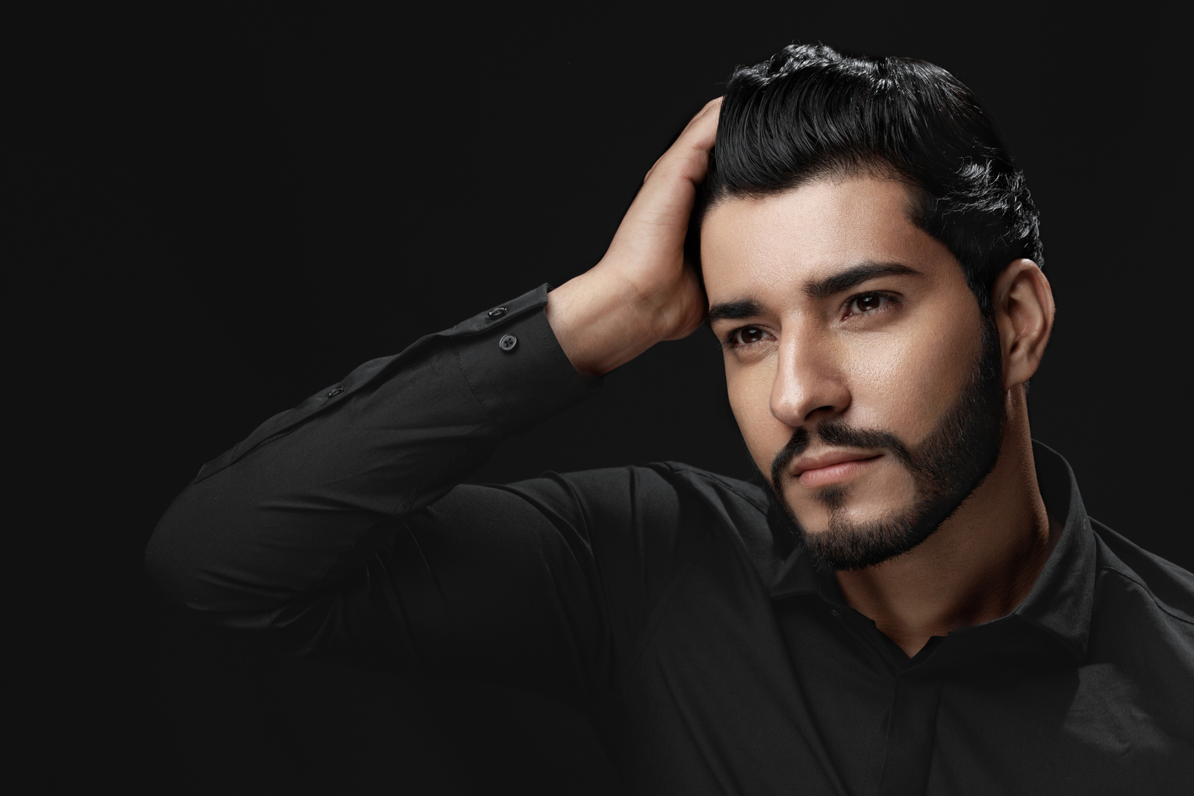 Men Hair Beauty. Handsome Male Model Touching Healthy Hair